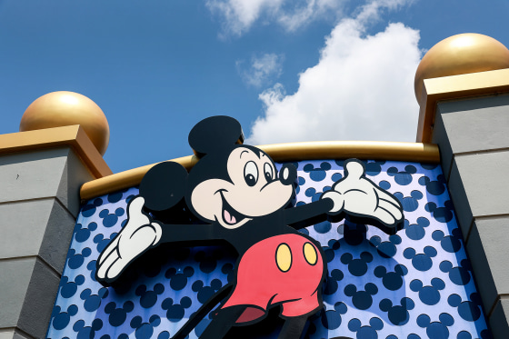 A Mickey Mouse sign showing Mickey smiling with his arms outstretched