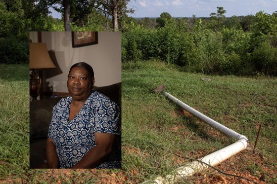 A portrait of a woman overlaid onto a landscape image showing a white PVC pipe stretched across a lawn.