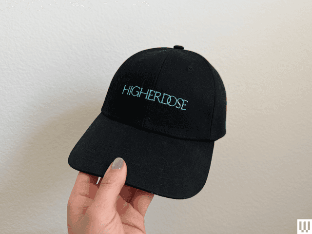 Image may contain: Baseball Cap, Cap, Clothing, and Hat