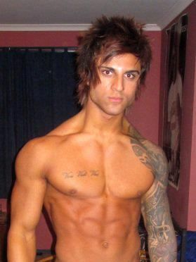 Image may contain Face Head Person Photography Portrait Skin Tattoo Back Body Part and Shoulder