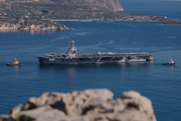 The USS Gerald R. Ford departs from Souda Naval Base near Chania on the island of Crete, Greece, Feb. 26, 2026. (AP Photo/Giannis Angelakis, File)