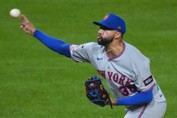 New York Mets pitcher Devin Williams delivers during the ninth inning of a baseball game against the Pittsburgh Pirates in Pittsburgh, Friday, Aug. 7, 2026. (AP Photo/Gene J. Puskar)