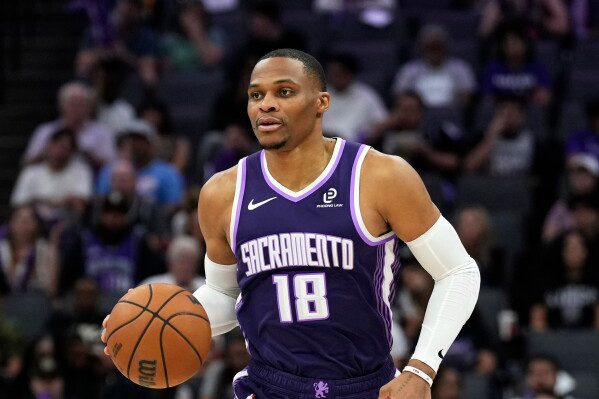 Sacramento Kings guard Russell Westbrook (18) dribbles the ball during the second half of an NBA basketball game against the Philadelphia 76ers, Thursday, March 19, 2026, in Sacramento, Calif. (AP Photo/Justine Willard,File)