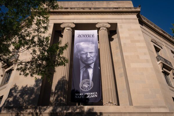 A portrait of President Donald Trump is displayed at the Justice Department building in Washington, June 2, 2026. (AP Photo/J. Scott Applewhite, File)