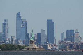 The New York skyline and Statue of Liberty are seen on May 12, 2025. (AP Photo/Matt Rourke, File)