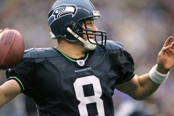 Seattle Seahawks quarterback Matt Hasselbeck passes during the fourth quarter against the Dallas Cowboys in Seattle, Oct. 23, 2005. (AP Photo/John Froschauer, File)