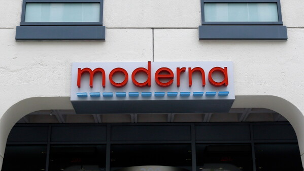 A sign marks an entrance to a Moderna building in Cambridge, Mass., May 18, 2020. (AP Photo/Bill Sikes, File)prnto