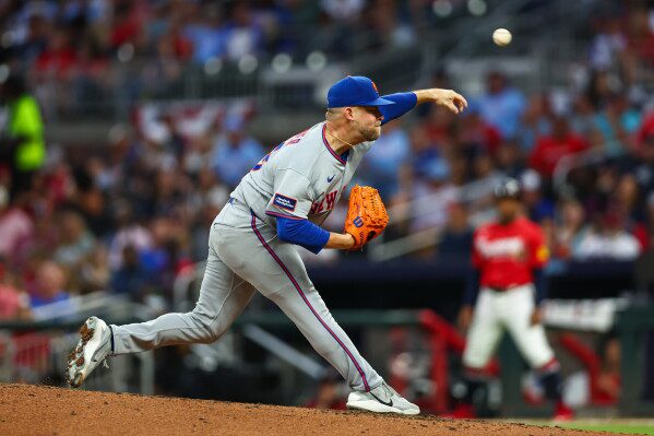 New York Mets pitcher A.J. Minter delivers in the fifth inning of a baseball game against the Atlanta Braves, Friday, July 3, 2026, in Atlanta. (AP Photo/Colin Hubbard)