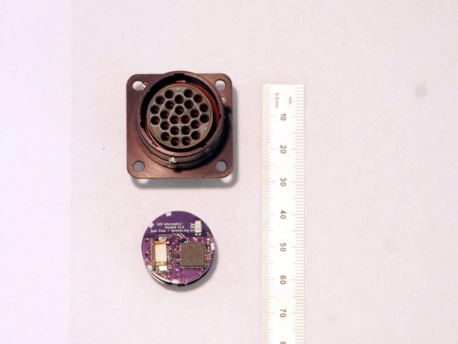 The hacking device  next to the connector it fits into on a Boeing 737 one that can be found inside a port thats...
